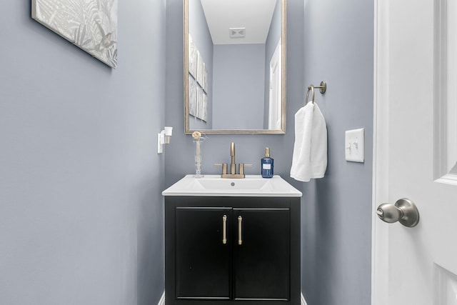 bathroom featuring visible vents and vanity