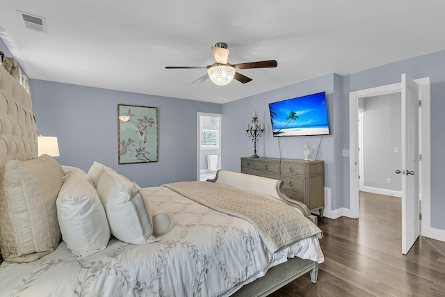 bedroom with dark wood-style floors, ceiling fan, visible vents, and baseboards