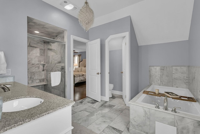 bathroom with marble finish floor, a garden tub, toilet, a stall shower, and vaulted ceiling