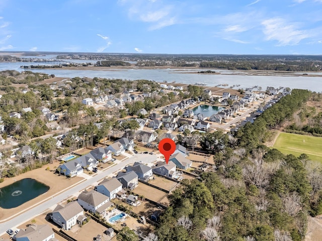 drone / aerial view featuring a water view and a residential view