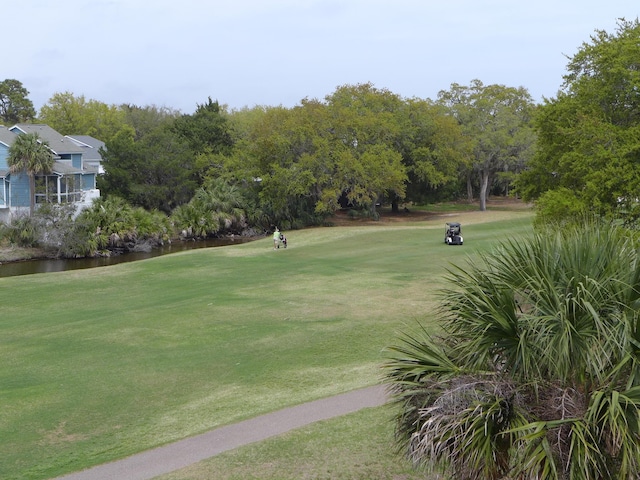 237 Driftwood Ln, Edisto Island, SC 29438 - view of property's community with a yard, view of golf course, and a water view