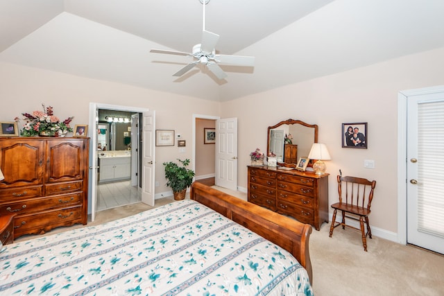 bedroom with ensuite bath, light colored carpet, vaulted ceiling, and ceiling fan