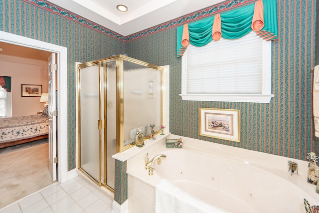 bathroom with independent shower and bath and tile patterned flooring