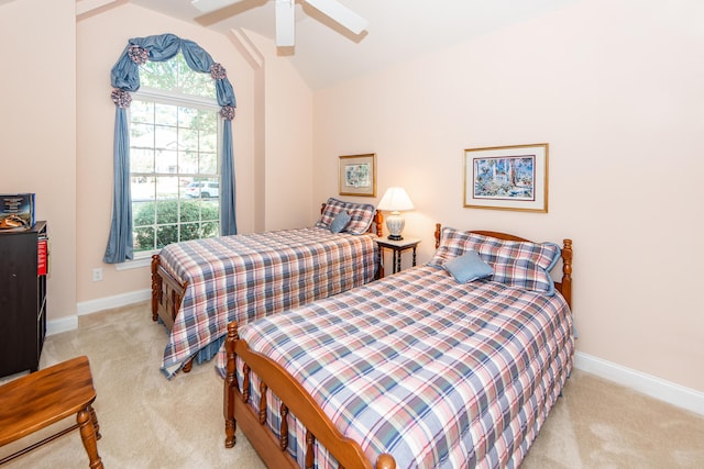 carpeted bedroom with lofted ceiling and ceiling fan