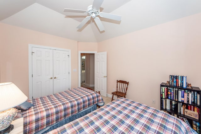 bedroom featuring vaulted ceiling, a closet, and ceiling fan