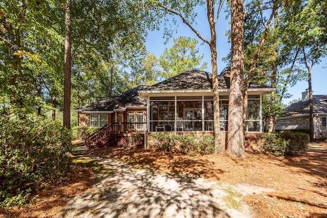 view of front of property with a sunroom