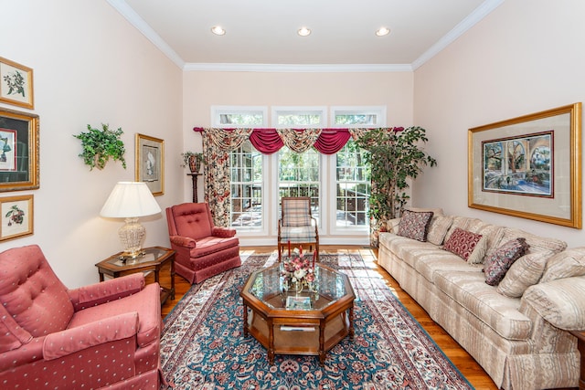 living room with crown molding and hardwood / wood-style flooring