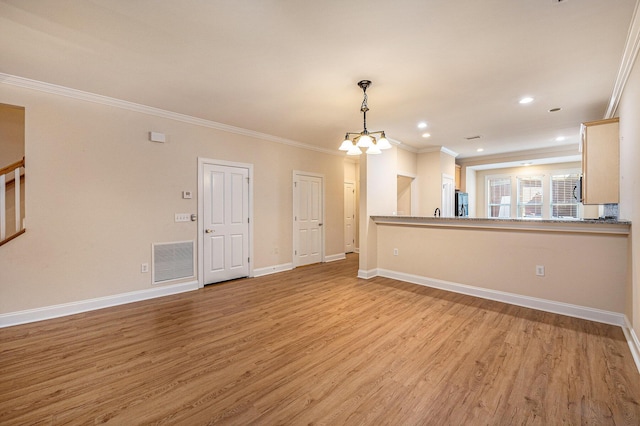 unfurnished living room with light wood-style flooring, visible vents, baseboards, ornamental molding, and a notable chandelier