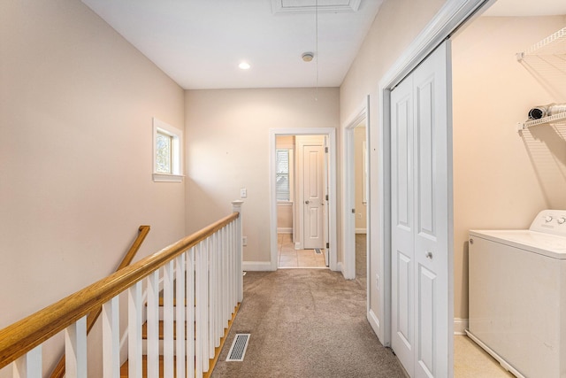 hall featuring attic access, recessed lighting, carpet flooring, washer / dryer, and visible vents