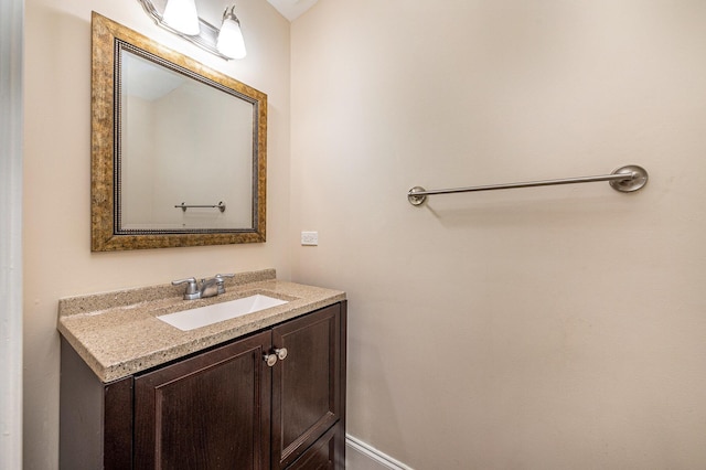 bathroom featuring vanity and baseboards