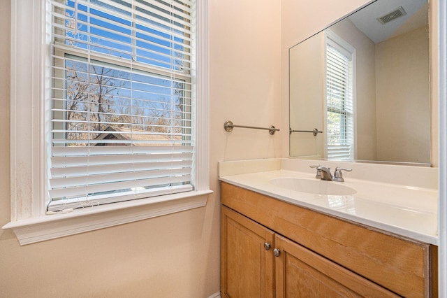 bathroom featuring visible vents and vanity
