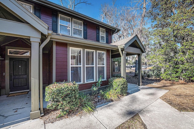 doorway to property with a porch