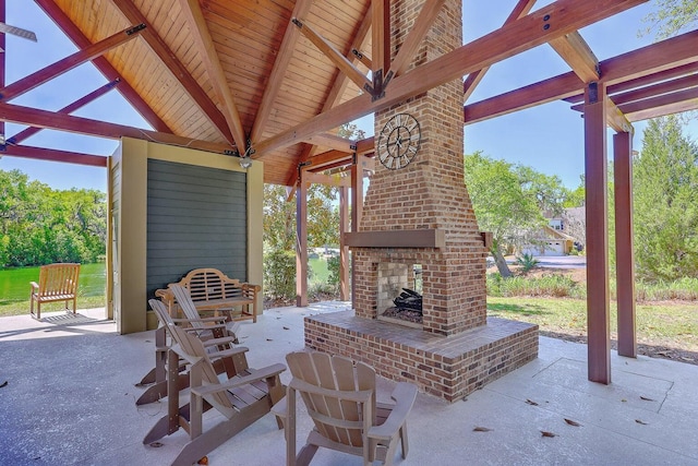 view of patio / terrace featuring an outdoor brick fireplace