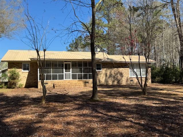 1188 Blackberry Bush Rd, Summerton, SC 29148 - rear view of house with a sunroom and brick siding