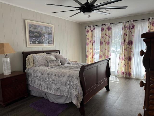 1188 Blackberry Bush Rd, Summerton, SC 29148 - bedroom featuring ornamental molding, a ceiling fan, and dark wood-style floors