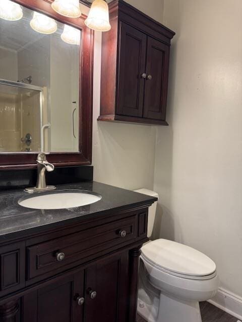 1188 Blackberry Bush Rd, Summerton, SC 29148 - bathroom with an enclosed shower, vanity, baseboards, and toilet