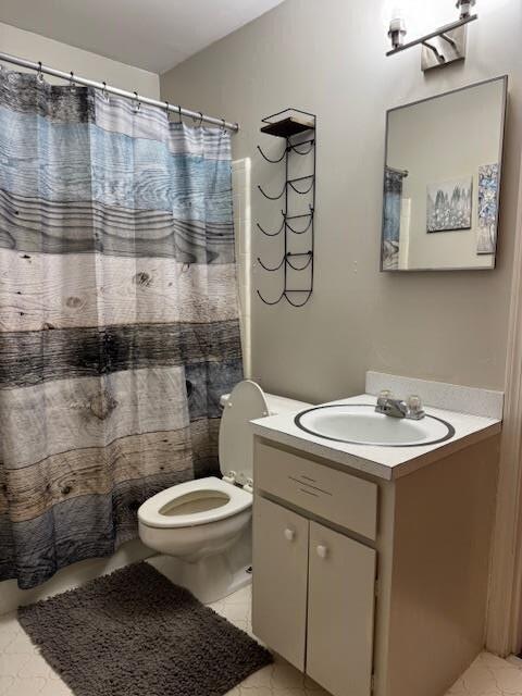 1188 Blackberry Bush Rd, Summerton, SC 29148 - bathroom with toilet, tile patterned floors, curtained shower, and vanity