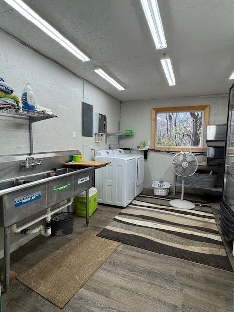 1188 Blackberry Bush Rd, Summerton, SC 29148 - clothes washing area featuring laundry area, wood finished floors, and washing machine and clothes dryer