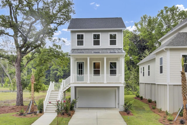 3029 Robeson Trce, Johns Island, SC 29455 - coastal inspired home featuring stairs, covered porch, driveway, a front lawn, and a garage