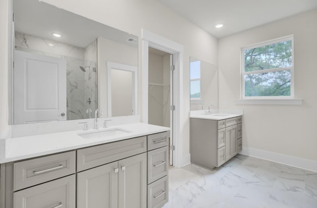 3029 Robeson Trce, Johns Island, SC 29455 - full bathroom with a marble finish shower, two vanities, marble finish floors, baseboards, and a walk in closet
