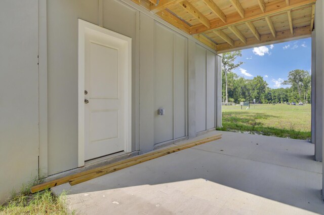 3029 Robeson Trce, Johns Island, SC 29455 - entrance to property with board and batten siding and a patio