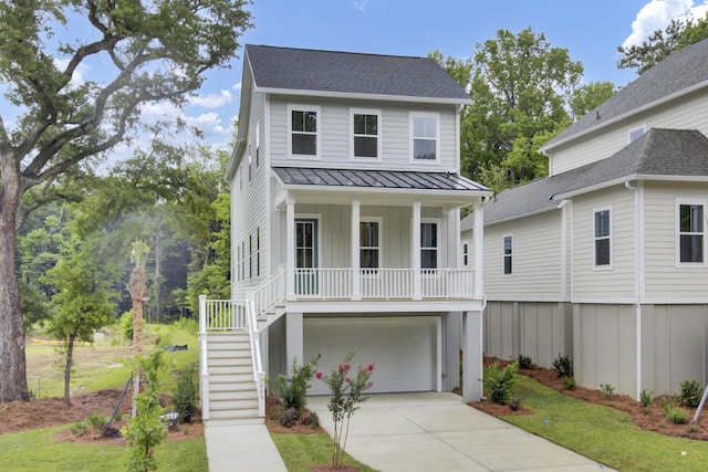 3029 Robeson Trce, Johns Island, SC 29455 - raised beach house with a porch, a standing seam roof, stairs, driveway, and board and batten siding