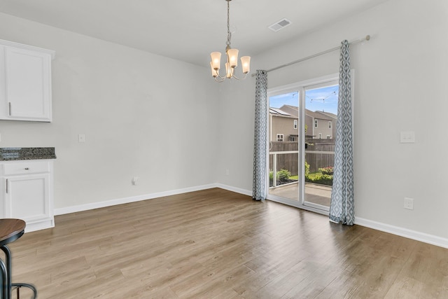 9706 Fanning Basket Ln, Ladson, SC 29456 - unfurnished dining area with visible vents, baseboards, a notable chandelier, and light wood-type flooring