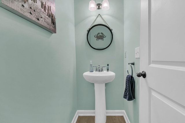 9706 Fanning Basket Ln, Ladson, SC 29456 - bathroom with a sink, baseboards, and wood finished floors