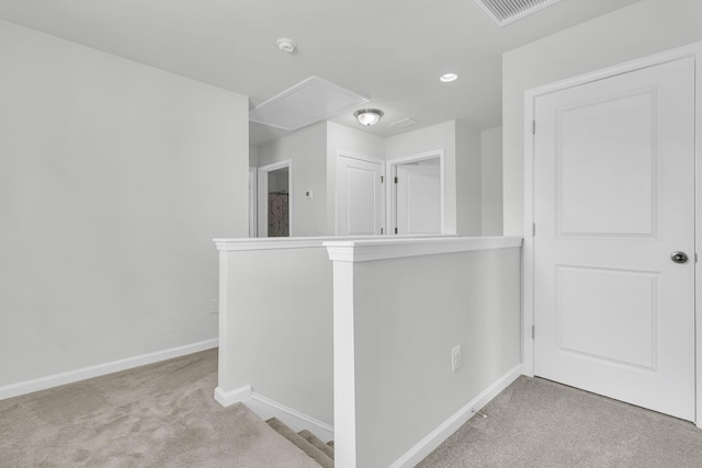 9706 Fanning Basket Ln, Ladson, SC 29456 - hall with attic access, visible vents, carpet floors, baseboards, and an upstairs landing