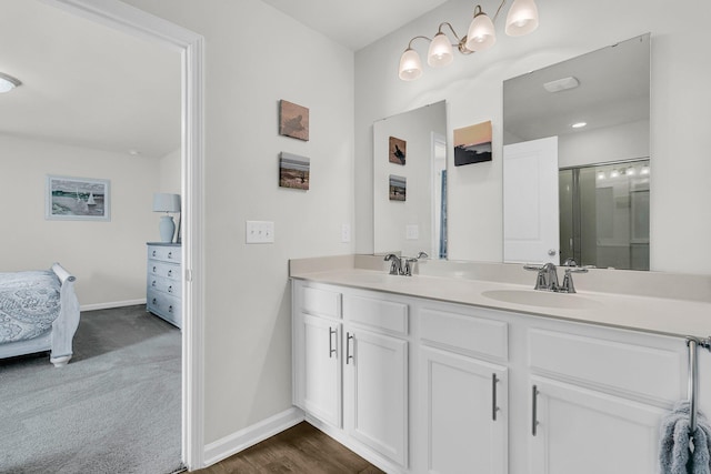 9706 Fanning Basket Ln, Ladson, SC 29456 - bathroom with a sink, baseboards, ensuite bathroom, and double vanity