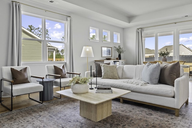 interior space with visible vents and wood finished floors