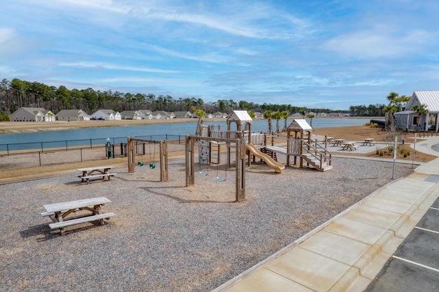 communal playground featuring a water view