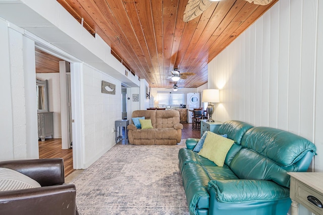 living room with light hardwood / wood-style flooring and wooden ceiling