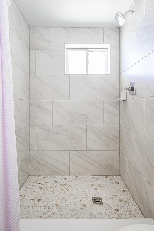 bathroom with toilet and curtained shower