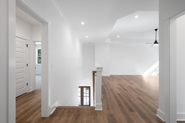 hall featuring hardwood / wood-style floors and ornamental molding