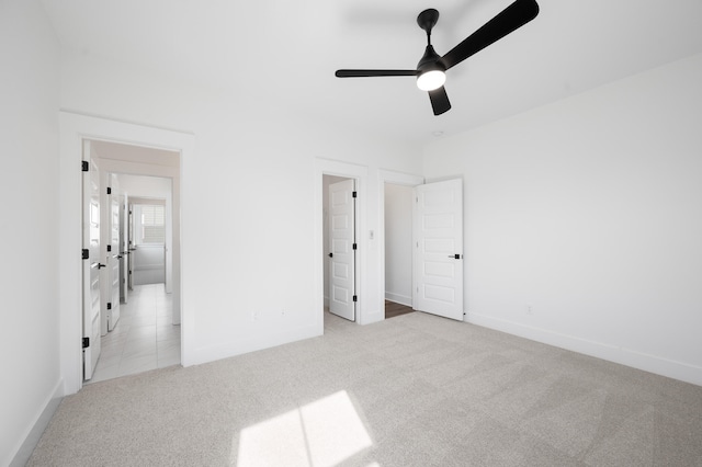 unfurnished bedroom with light carpet and ceiling fan