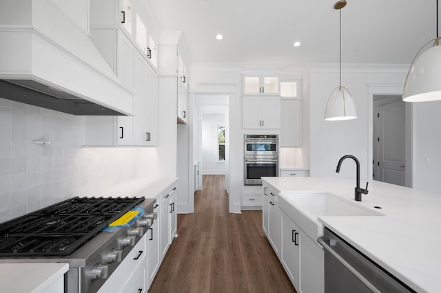 kitchen with white cabinetry, stainless steel appliances, tasteful backsplash, dark hardwood / wood-style floors, and decorative light fixtures