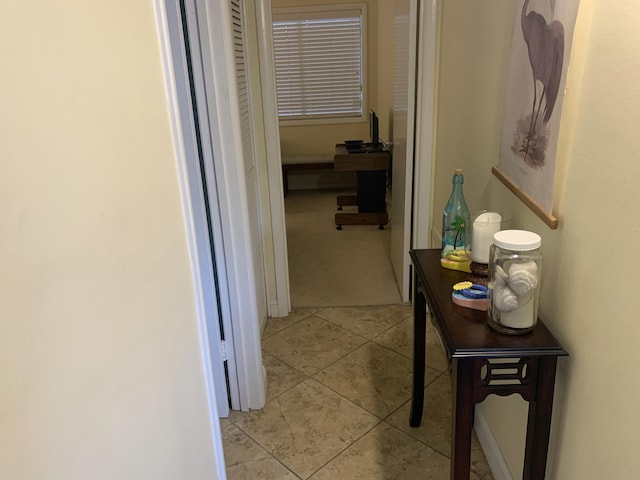 hallway with light tile patterned flooring