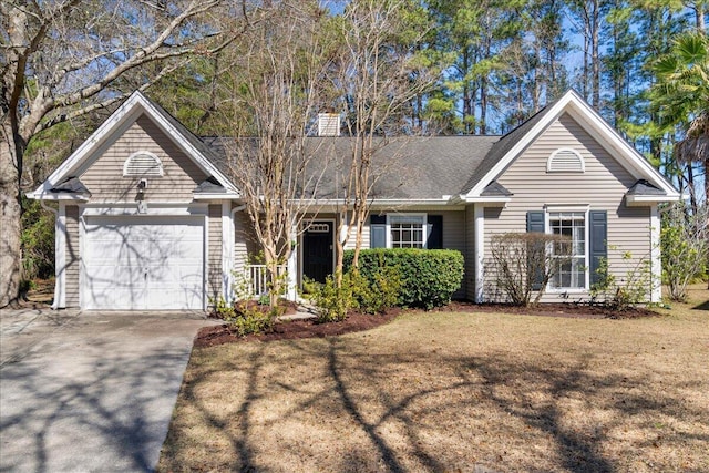 view of front of house with a garage and a front yard