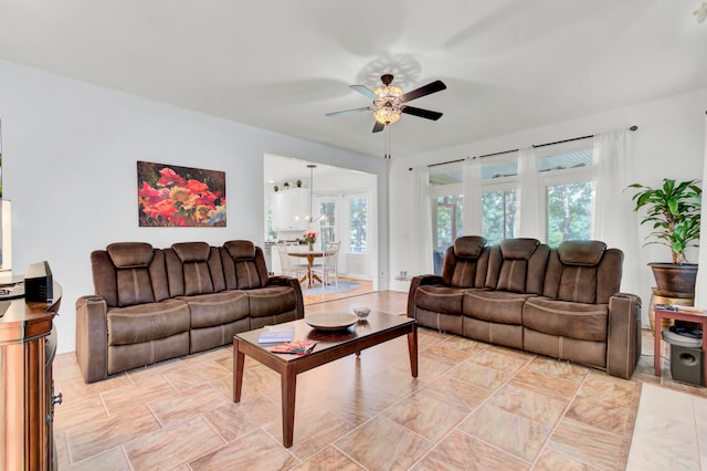 tiled living room with ceiling fan