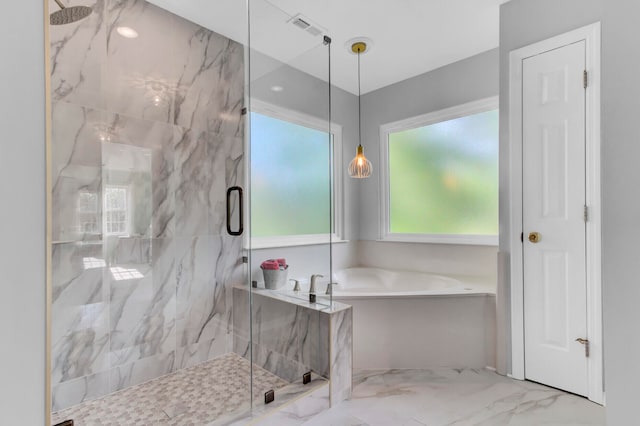 bathroom with tile patterned floors and independent shower and bath