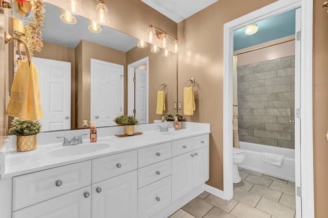 full bathroom with dual vanity, toilet, tile patterned floors, and shower / bath combo