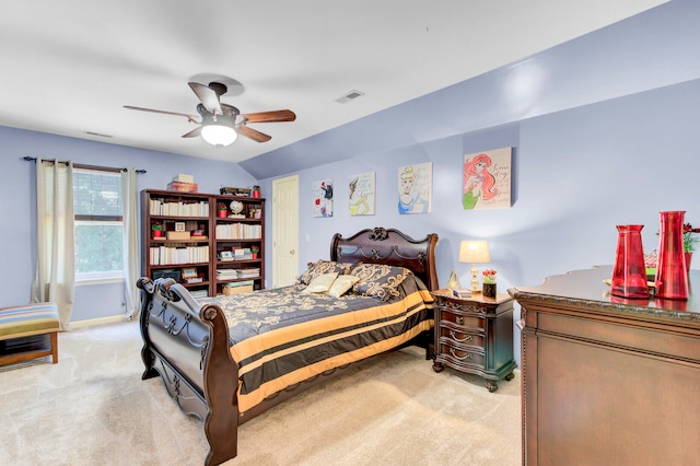 bedroom with ceiling fan, lofted ceiling, and light carpet