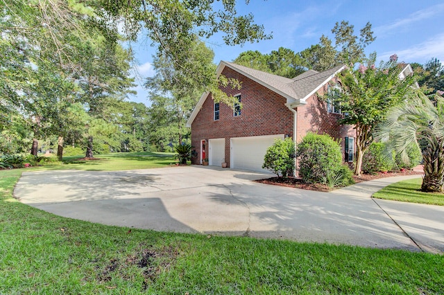 view of side of home with a garage and a yard