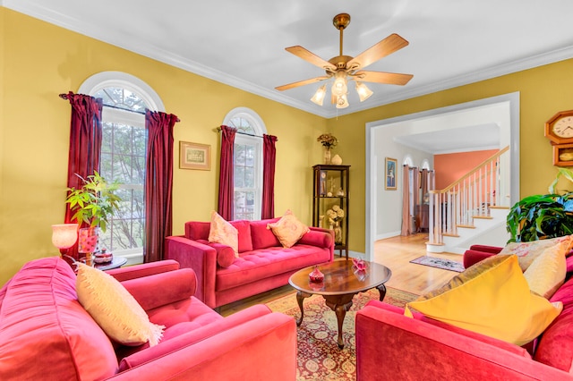 living room with crown molding, hardwood / wood-style floors, and ceiling fan