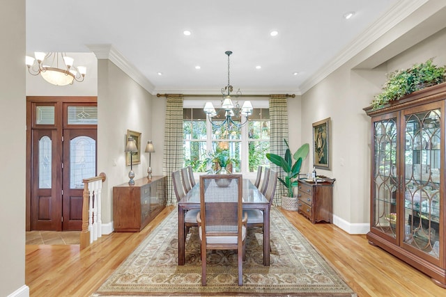 dining room featuring plenty of natural light, a notable chandelier, and light hardwood / wood-style floors