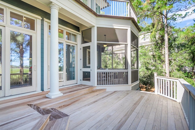 wooden terrace with a sunroom