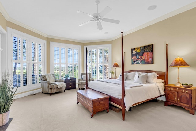 carpeted bedroom featuring ornamental molding, multiple windows, and ceiling fan