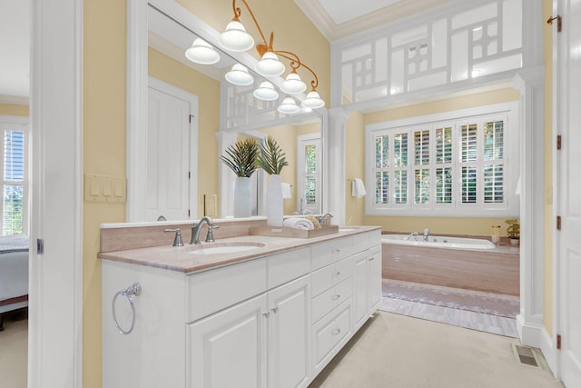 bathroom featuring ornamental molding, tiled bath, and vanity