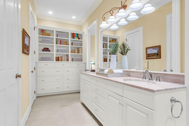 bathroom featuring vanity and ornamental molding